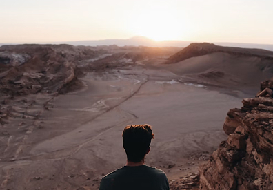 Valle de la Luna in Chile. Visit near sunset and place a person low in the frame for scale. Tap the bright sky on your phone screen to keep the desert colors rich.