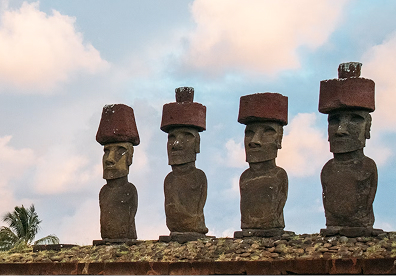 Easter Island, Rapa Nui in Chile. Notice the red stone cylinders, called pukao, on some moai. Their different stone and color reveal another layer of Rapa Nui craftsmanship.