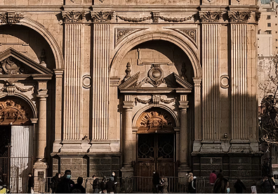Santiago Metropolitan Cathedral in Chile. Study the stonework and balanced columns of the facade. Architect Joaqu&iacute;n Toesca designed it in the 1700s but never lived to see it completed.